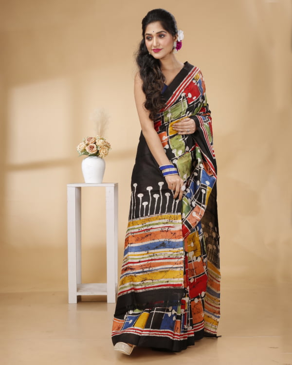 Nakshipar Black & Multicolour Batik on Pleats & Pallu With Reddish Orange Saree