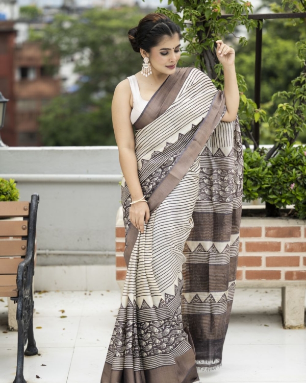 deep-brown-fish-motif-skirt-border-with-horizontal-lines-on-zari-border-tussar-saree