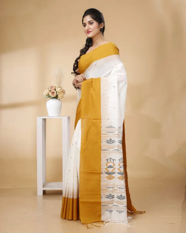 Nakshipar's Occur Yellow Border white base Cotton handloom saree