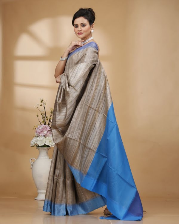 Nakshipar Gray Color Gicha Tussar Saree with Blue Pallu