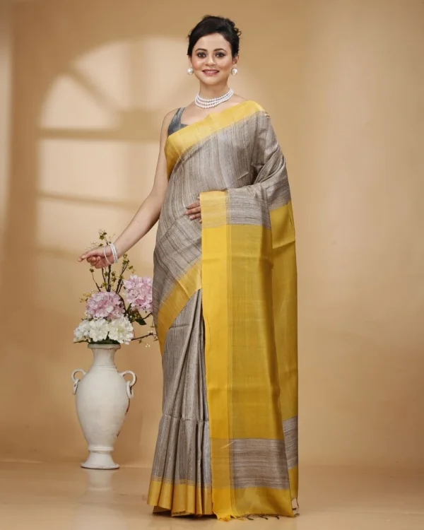 Nakshipar Gray Color Gicha Tussar Saree with Yellow Pallu