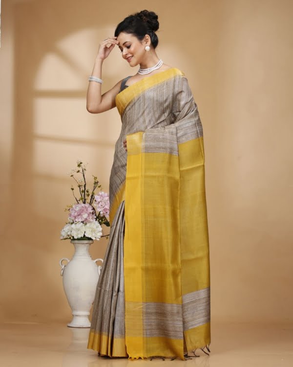 Nakshipar Gray Color Gicha Tussar Saree with Yellow Pallu