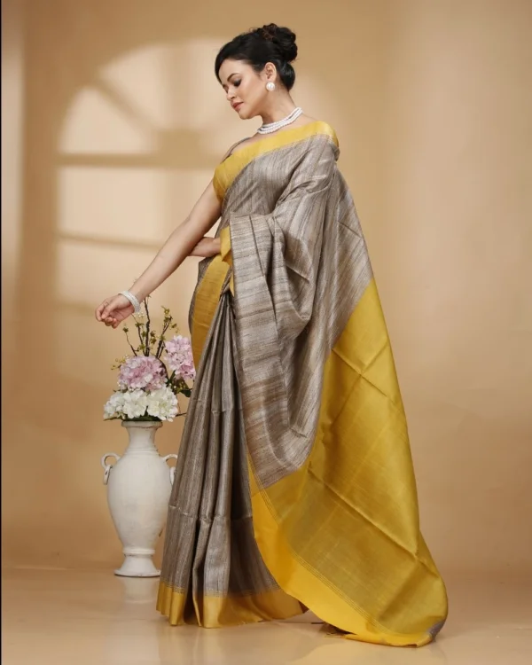 Nakshipar Gray Color Gicha Tussar Saree with Yellow Pallu