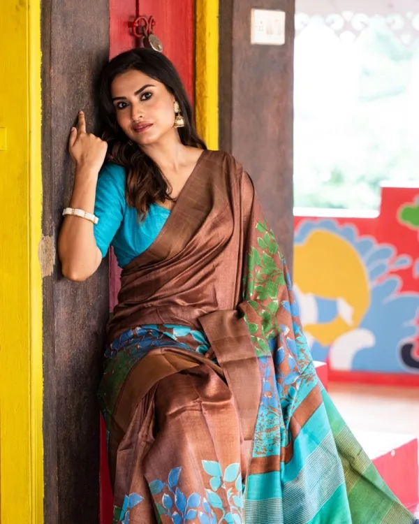 Nakshipar Green, Blue & Sky Blue Pagely Design on Deep Brown Zari Border Tussar Saree