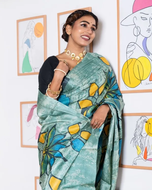 Nakshipar Blue, Black and Yellow Floral on Sea Green Self Printed Tussar Saree