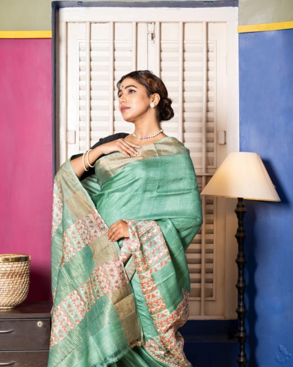 Nakshipar Deep Sea Green & Orange Abstract Print on Sea Green Zari Border Tussar Saree