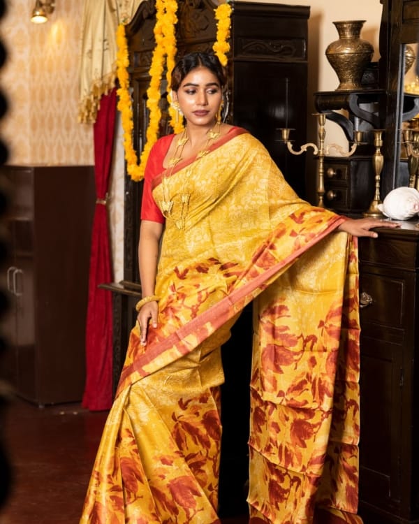 Nakshipar Golden Yellow and Orange print on Yellow Tussar Saree